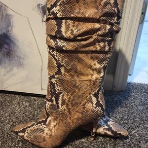 Fitted knee high multi color snake skin boot.